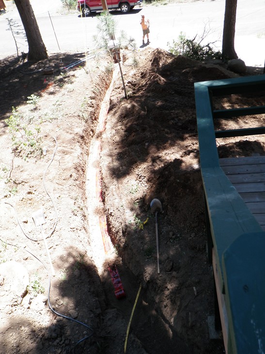 The utility conduit was buried and marked with tape.