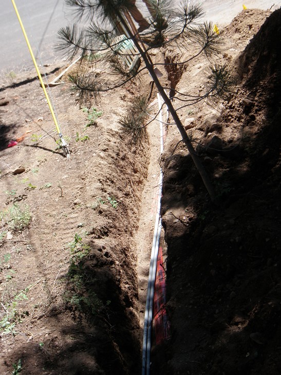 Then the cable and phone conduit went in.  They even saved our small pine tree.