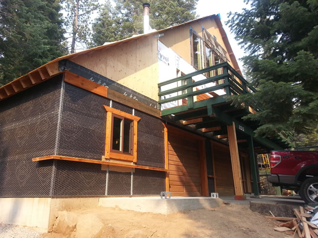 Stucco paper & wire, rock ledger board all installed.