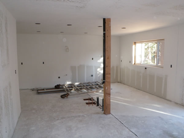 Kitchen & dining with smooth wall in kitchen and texture in dining area.
