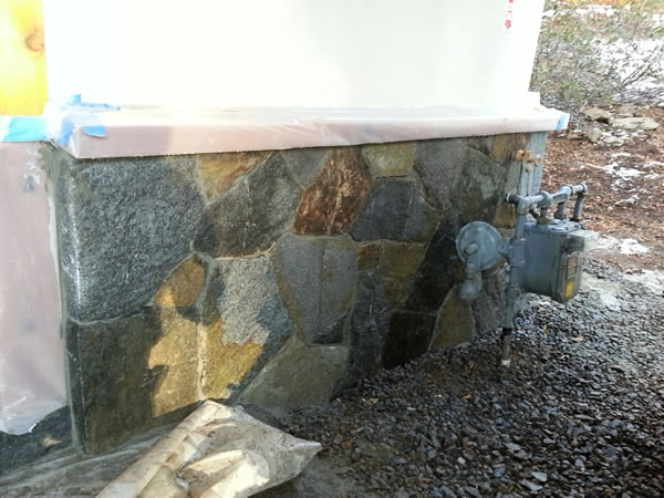 Finished granite behind the gas meter.
